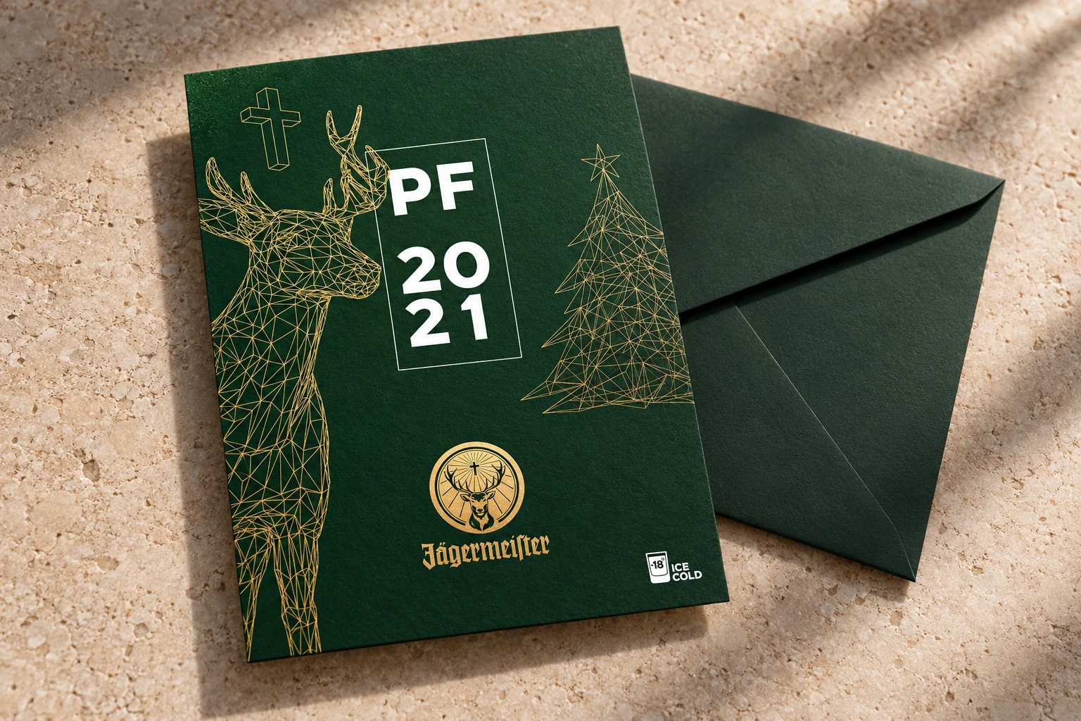 Jägermeister’s New Year greeting as a printed card with a gold illustration.